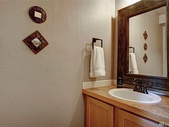 The guest bath features updated toilet, mirror, faucet and lighting ~ so elegant and impressive!