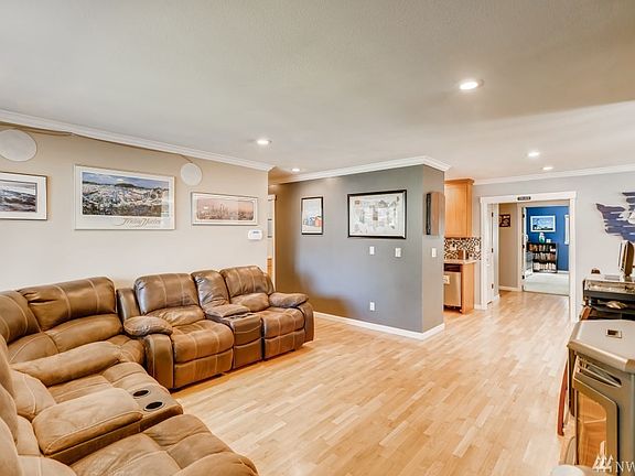 From the front door you can see the hallway to the left which leads to three of the bedrooms. The dining room is on the right, the kitchen is on the left and the huge master bedroom, or family room, is directly ahead.