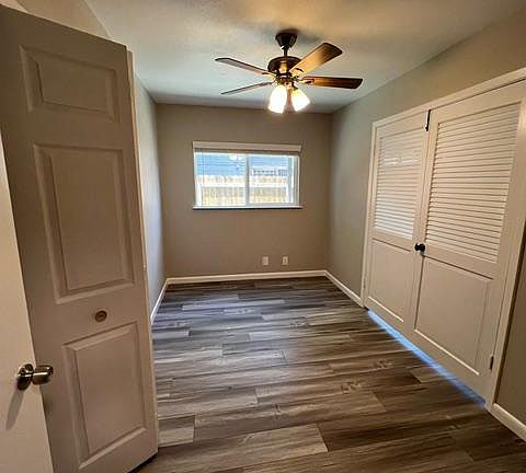 1st of 2 bedrooms. Double doors open to living room, plus there's a door to the hall. Perfect as home office or bedroom.