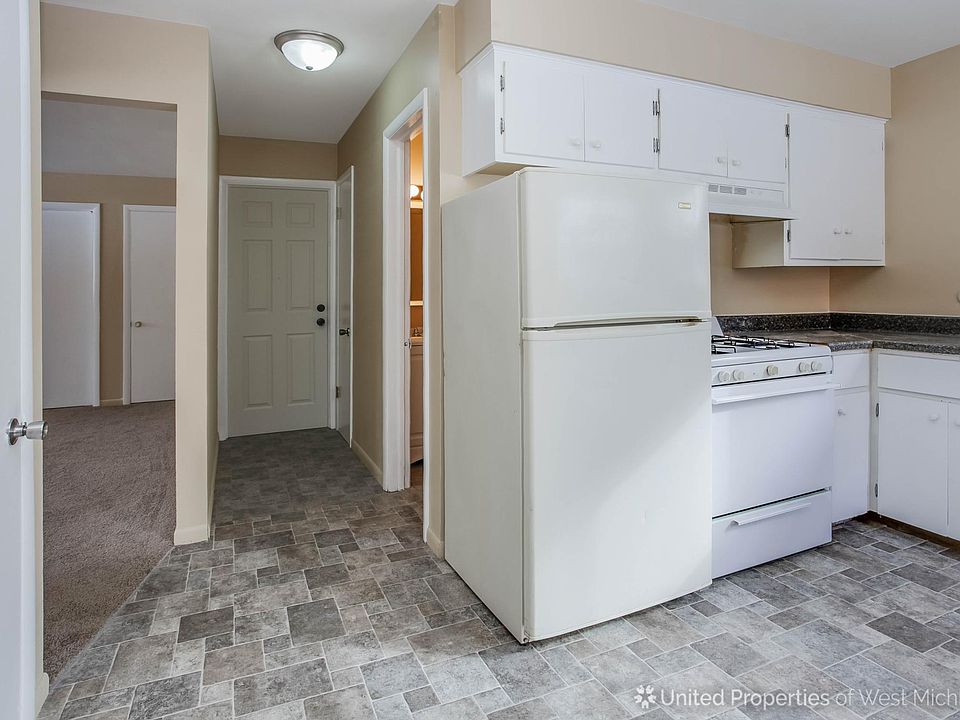 Kitchen, hallway to bathroom and community coin laundry room.