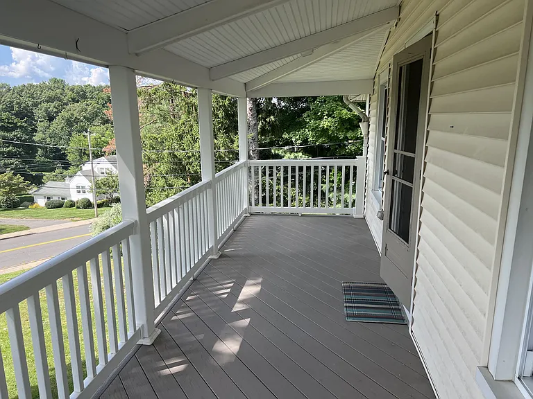 Lovely trex spacious porch. This porch adds living space to the unit in the warmer months.