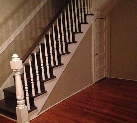 Stairwell and a glimpse of hardwood flooring