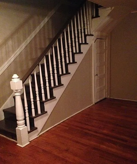 Stairwell and a glimpse of hardwood flooring