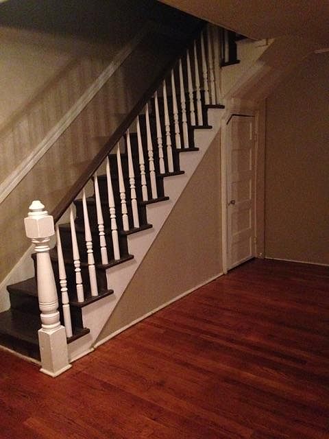 Stairwell and glimpse of hardwood flooring