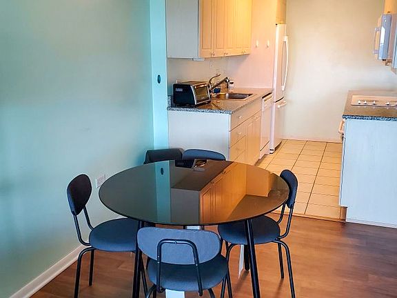 Dining Table and Kitchen with new flooring