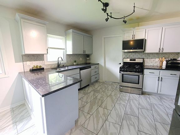 5th image of 1142 W 72nd Ln