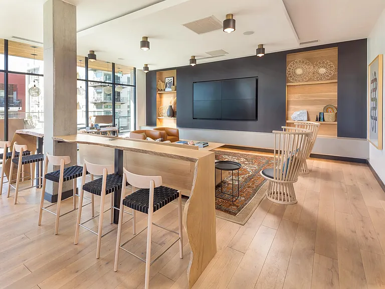 WiFi lounge with large flatscreen TV and coffee bar.