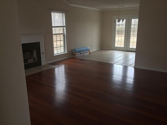Hardwood floors and ceramic tile in kitchen and baths