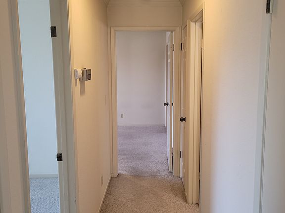 Bedroom 2 (left), Bathroom (right), Main Bedroom (end)