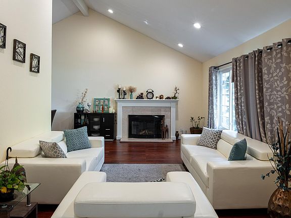 Living room with high ceiling and recess lighting