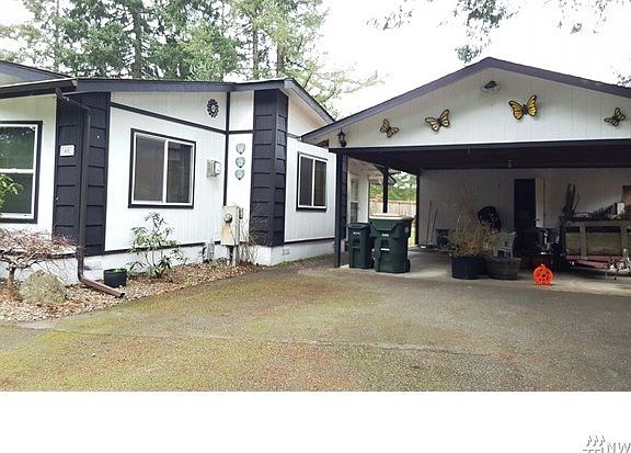 2 car carport with shop in back.