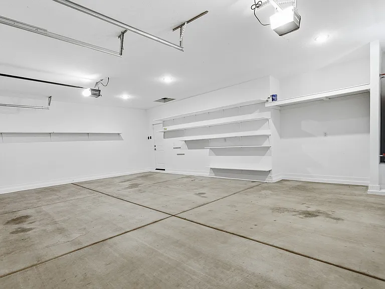 3-car garage with shelves