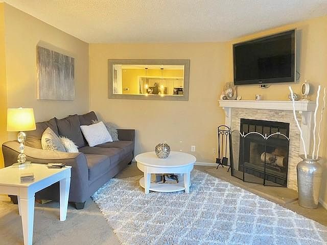 Living room with wood burning fireplace