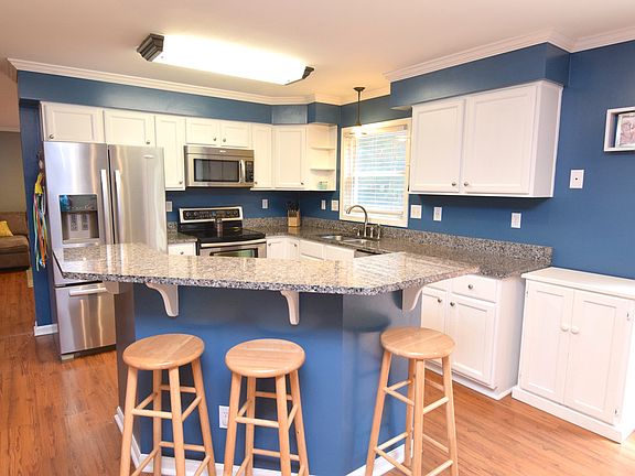 Brand new granite counter tops and new stainless steel appliances.