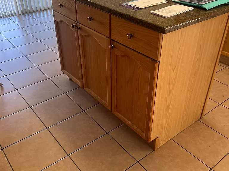 29 - Kitchen island with lower cabinets and wide work surface.