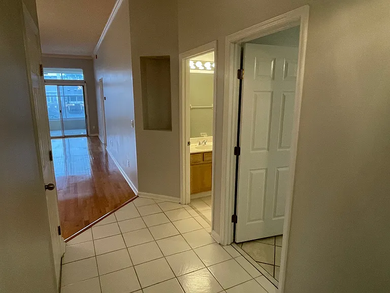Entry Hallway looking at 2nd bath and entry into Bedroom 2
