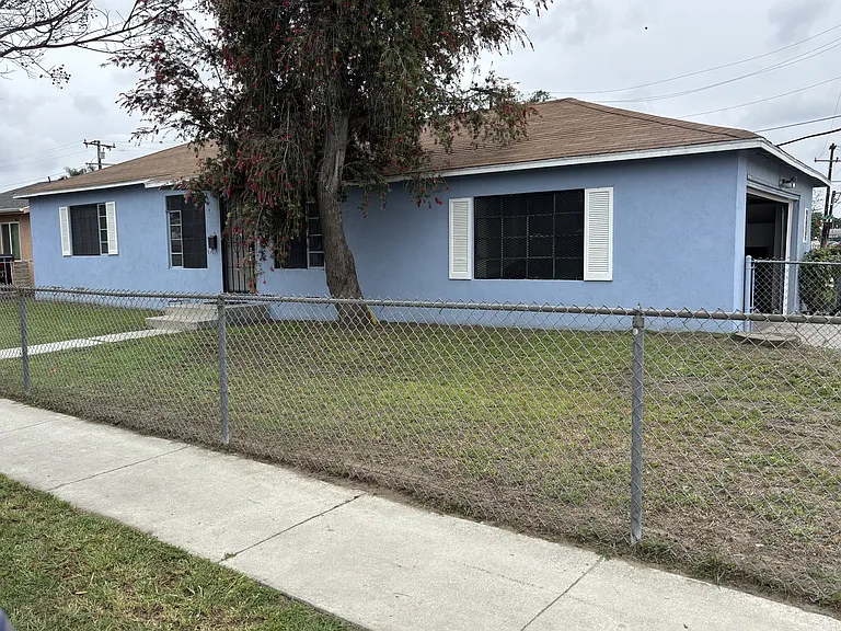 Front of house and front yard. Garage around to the right side.