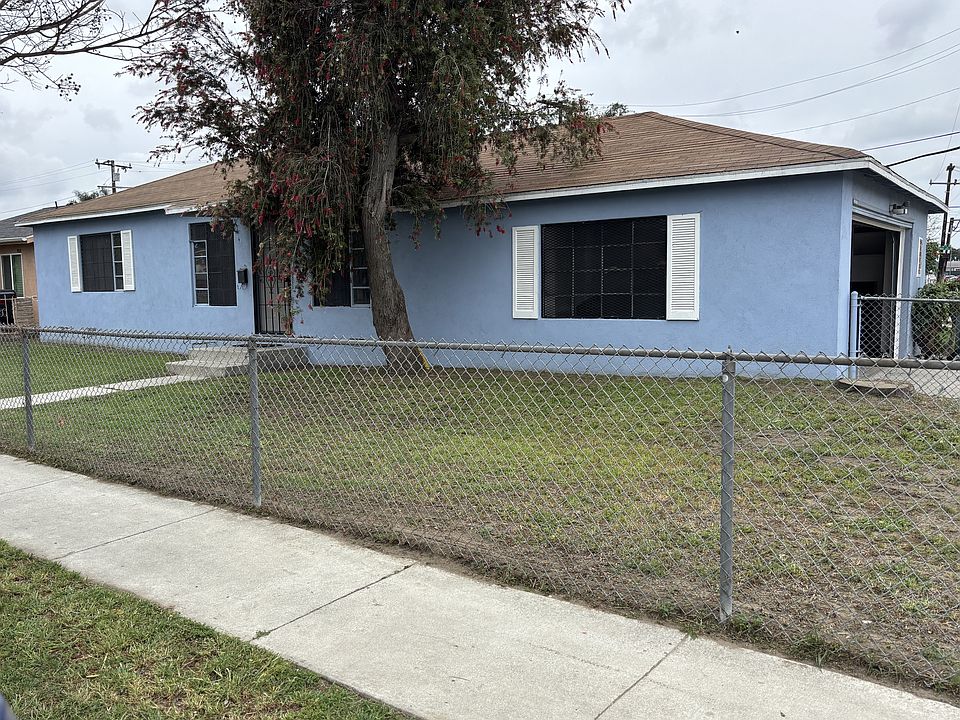 Front of house and front yard. Garage around to the right side.