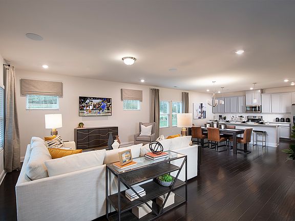 The open-concept layout allows for an easy flow between the kitchen, dining, and living areas.