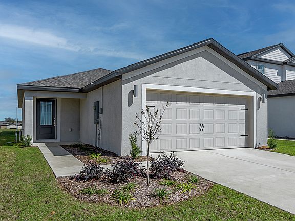 The Hernando is a beautiful home with a two car garage