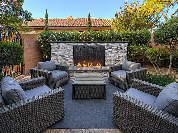 Private outdoor lounge with 12 foot wide water/fire feature