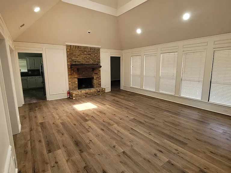 Living room with beautiful cathedral skylight, let's in a ton of natural light!