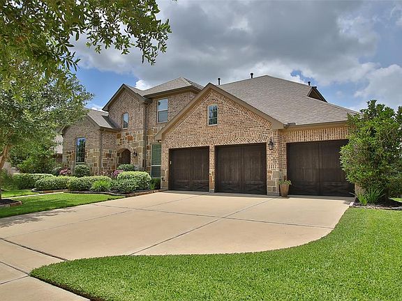 An extra wide driveway with stately 3-car garage allows room for plenty of parking!