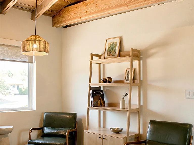 Cozy seating nook with vaulted ceiling and exposed beams.