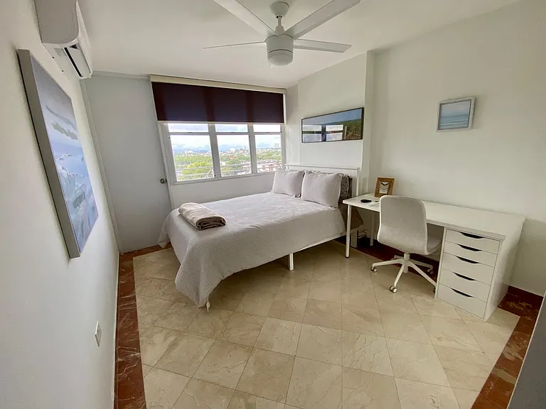 2nd bedroom with balcony access and sliding mirror closet