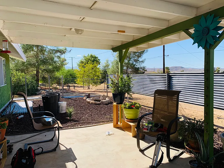 Private back patio fence blocks out neighbors but not the view or the bunnies