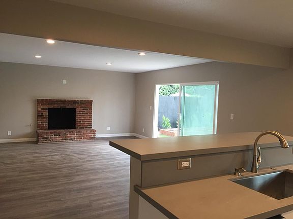 View from kitchen looking at fireplace