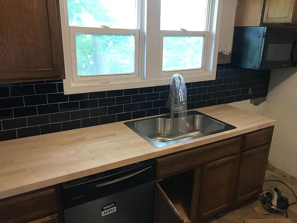 Single basin sink and new faucet. Stainless Dishwasher