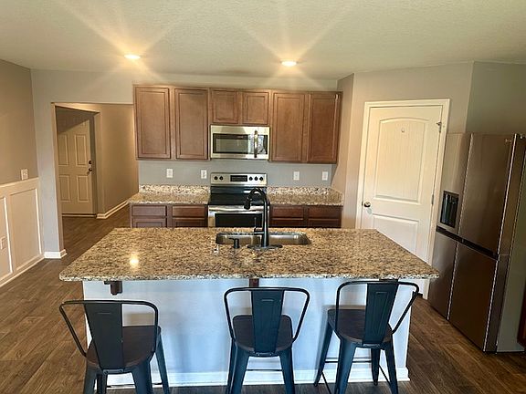 Kitchen with breakfast bar and full-size pantry