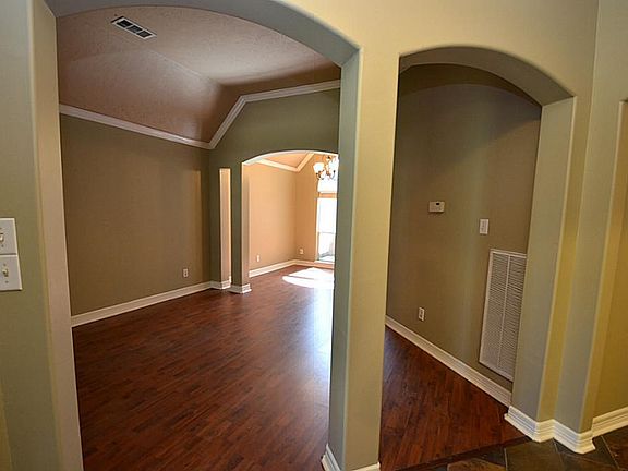 As you walk in the home there are wonderful archways leading you to the formal living and dining are