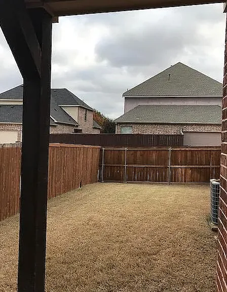 COVERED PATIO WITH FENCED YARD