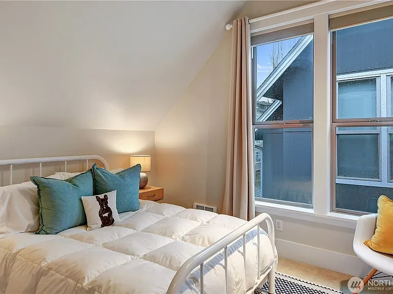 The smaller of two upper bedrooms is served by a lighted walk-in closet.