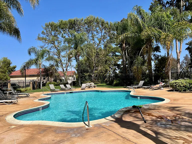 Residents enjoy access to a beautifully maintained community pool and BBQ area_perfect for weekend gatherings, relaxing, and outdoor fun.