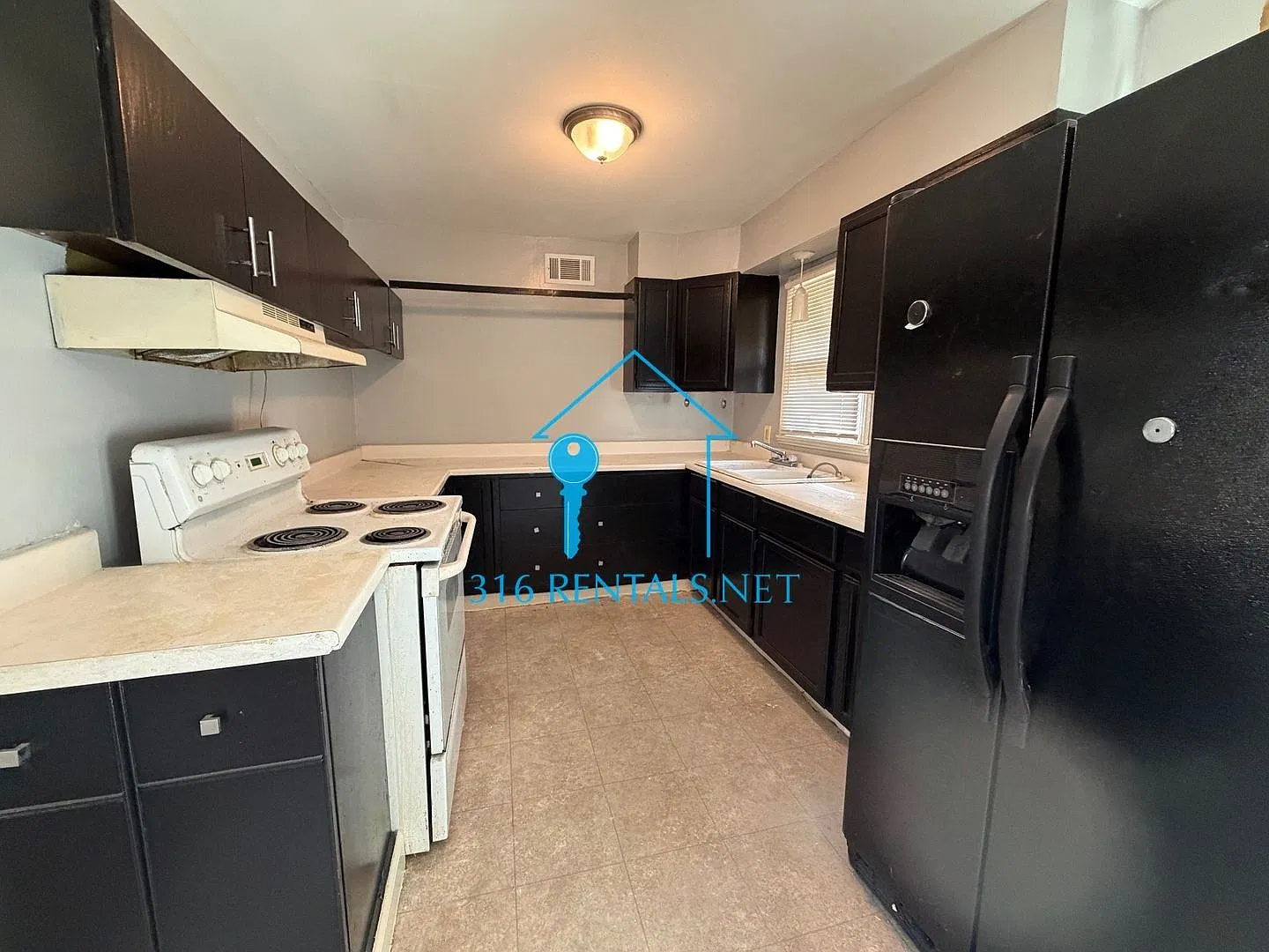 $1,245 | 4 Bed Wichita Home | Hardwood Floors, Fenced Yard & Deck | Pets OK — Photo 3