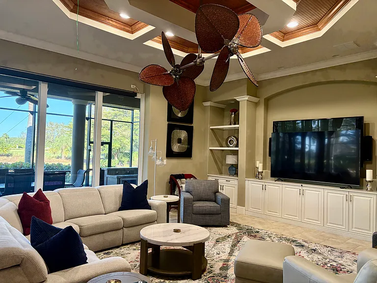Living Room with sliders to outdoor covered lanai. Sonos Sound System, Smart TV