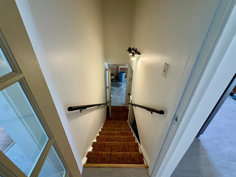 Stairs to garage and basement