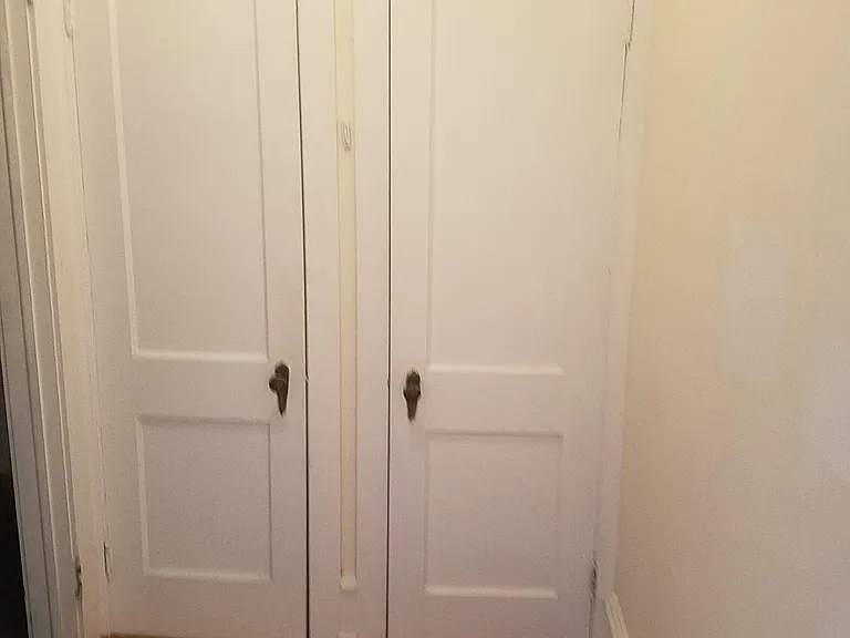 Entry Closets, Historic panel doors Decco knobs