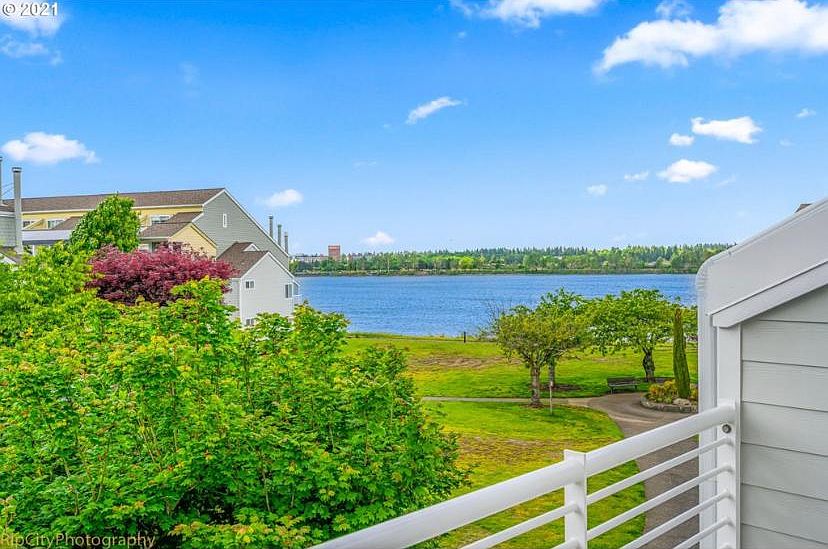 View of Columbia River from balcony, welcoming entrance (door on R), open kitchen with counter for stools, ceiling fans, tub/shower combo, personal washer and dryer, wood fireplace, walking paths along waterfront and near marina, indoor pool/jacuzzi and o