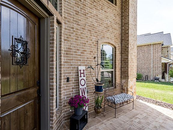 A quaint front porch offers a spot for you to sit and enjoy a cool beverage and wave to the neighbors as they take their evening stroll! There is also ample room for all those Amazon deliveries!