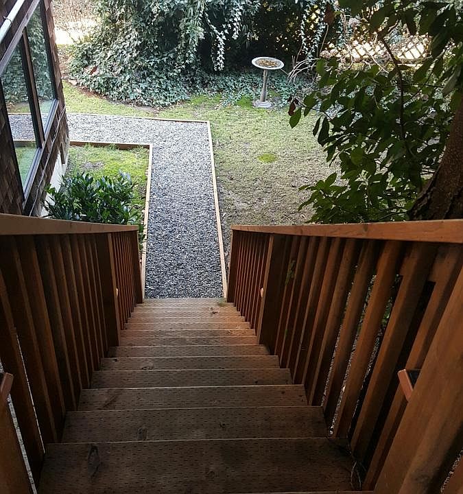 From the off-street parking, go down the stairs to your garden level yard.