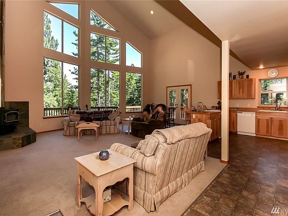 HUGE greatroom on the main floor. Tons of natural light from the floor to ceiling windows, all adorned with a free standing wood stove! 