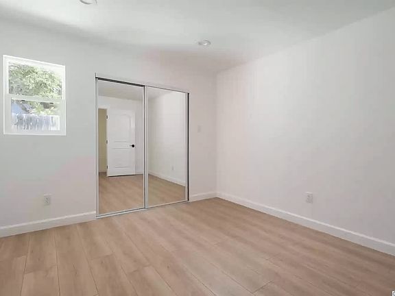 Empty view of bedroom and closet.