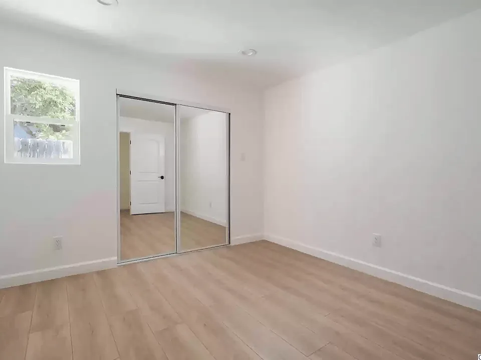 Empty view of bedroom and closet.