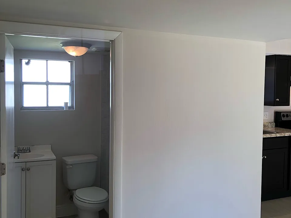 The entry door to the bathroom.
