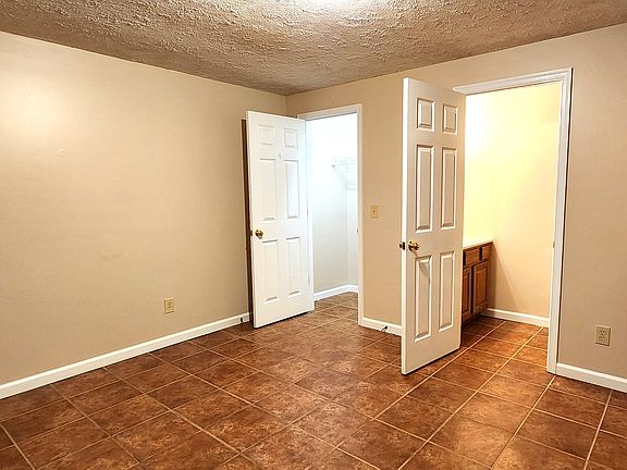 Another view within the Bonus Room with half bath