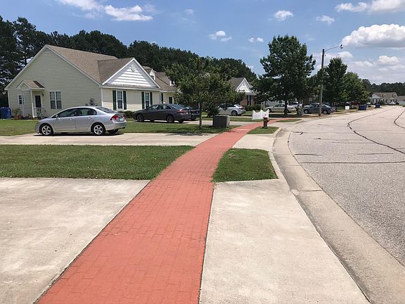 Sidewalks for evening strolls surround the community